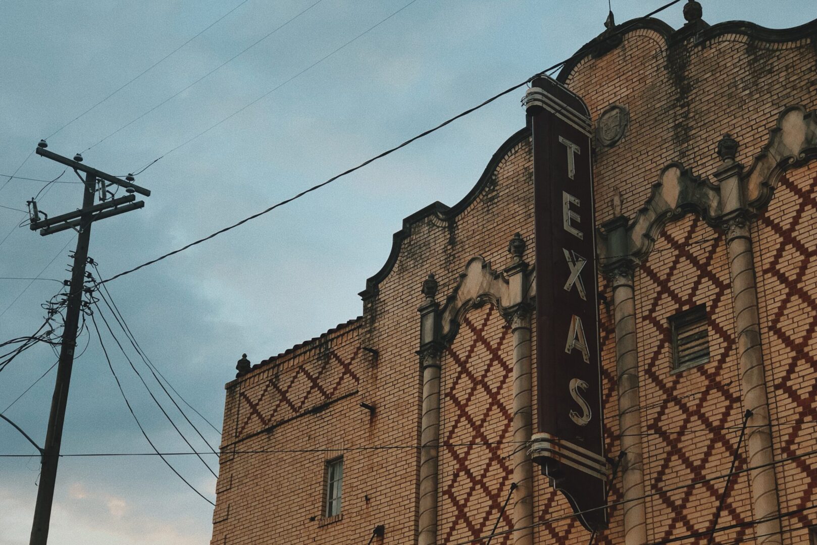 A building with an old texas sign on it