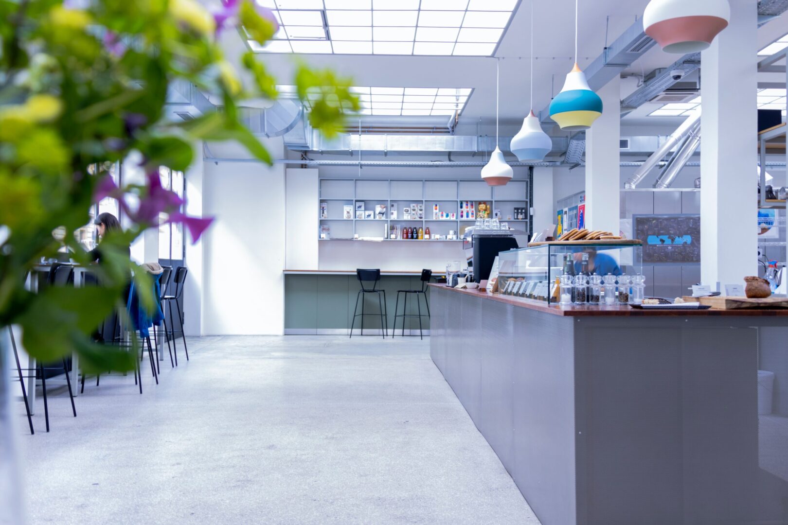 A kitchen with a counter and some tables